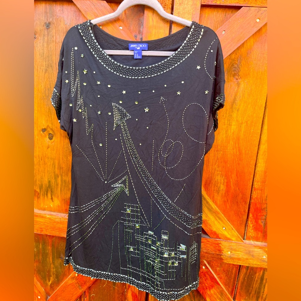A black Jimmy Choo for H&M dress with sequinned detail.